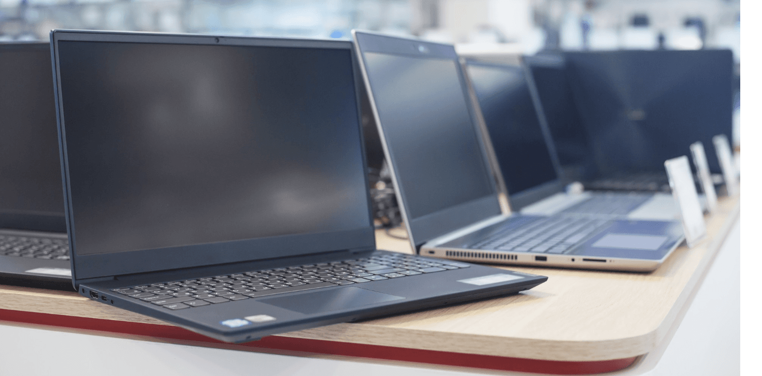 Row of enterprise laptops and hardware on display